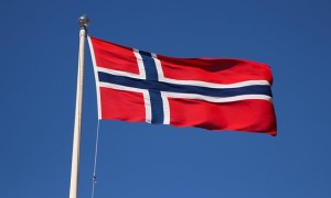 Norway flag flying on flagpost