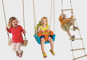 Children in swings and on rope ladder