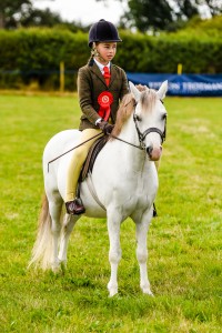 girl rider on grey pony