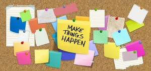 Make things happen sticker on pinboard