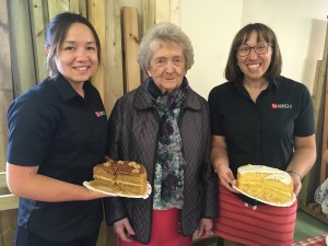 Three women with cakes