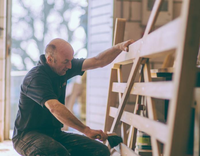 Craftsman making wooden gate