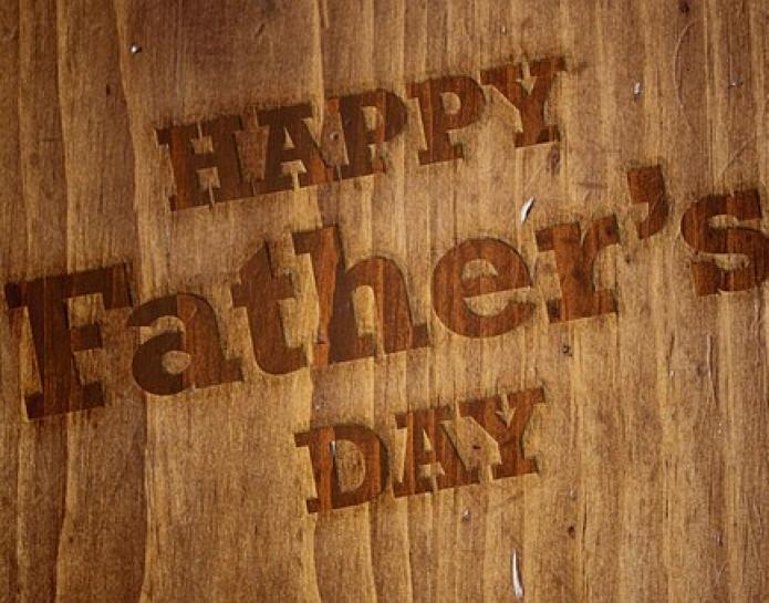Happy Father's Day message on wooden board