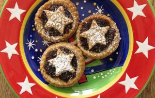 three mince pies on a star plate