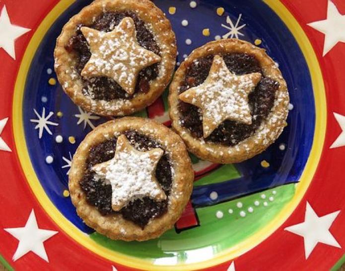 three mince pies on a star plate