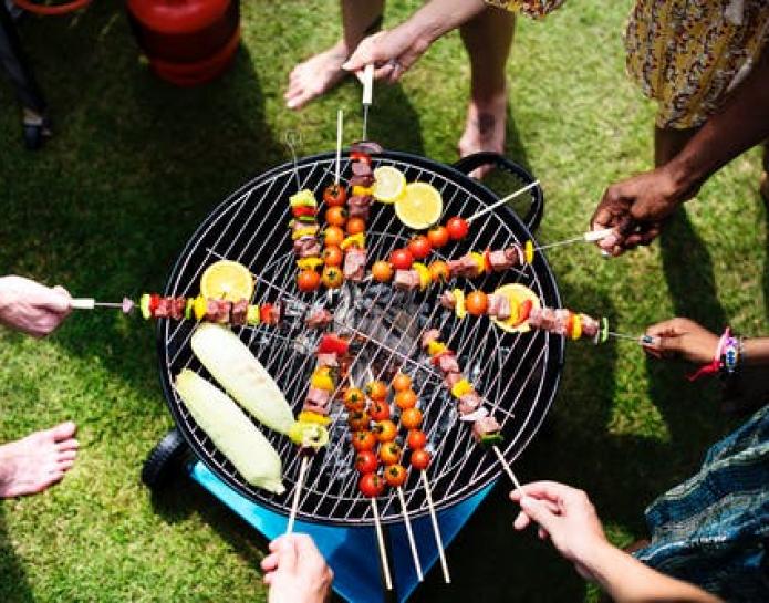 People around a barbecue