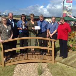 John Bright team celebratign award on bridge