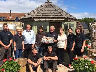 Team outside summerhouse