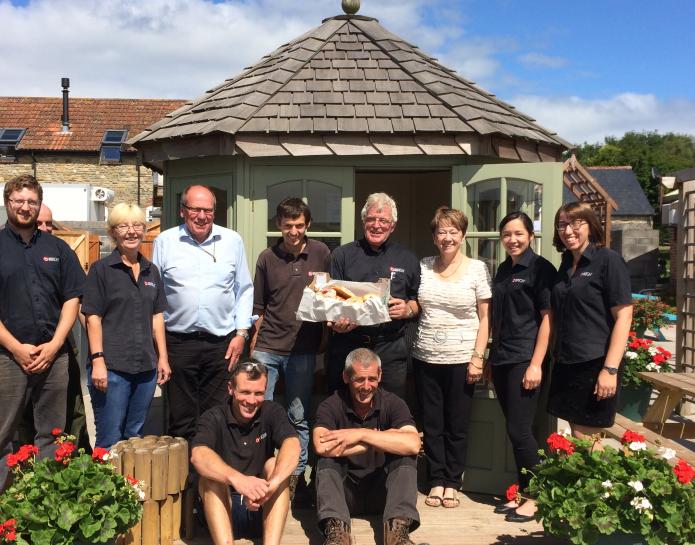 Team outside summerhouse